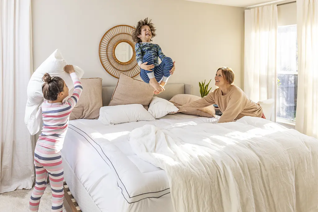 Kids jumping on bed